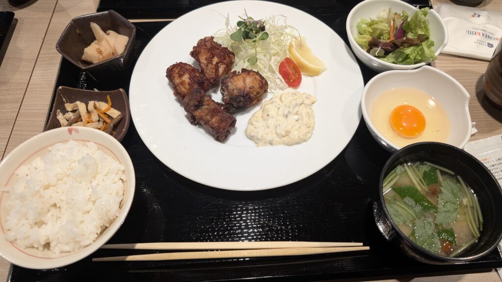 Tatsuta-age fried chicken lunch set with rice, raw egg, and side dishes at WAshu WAshoku in Tamachi