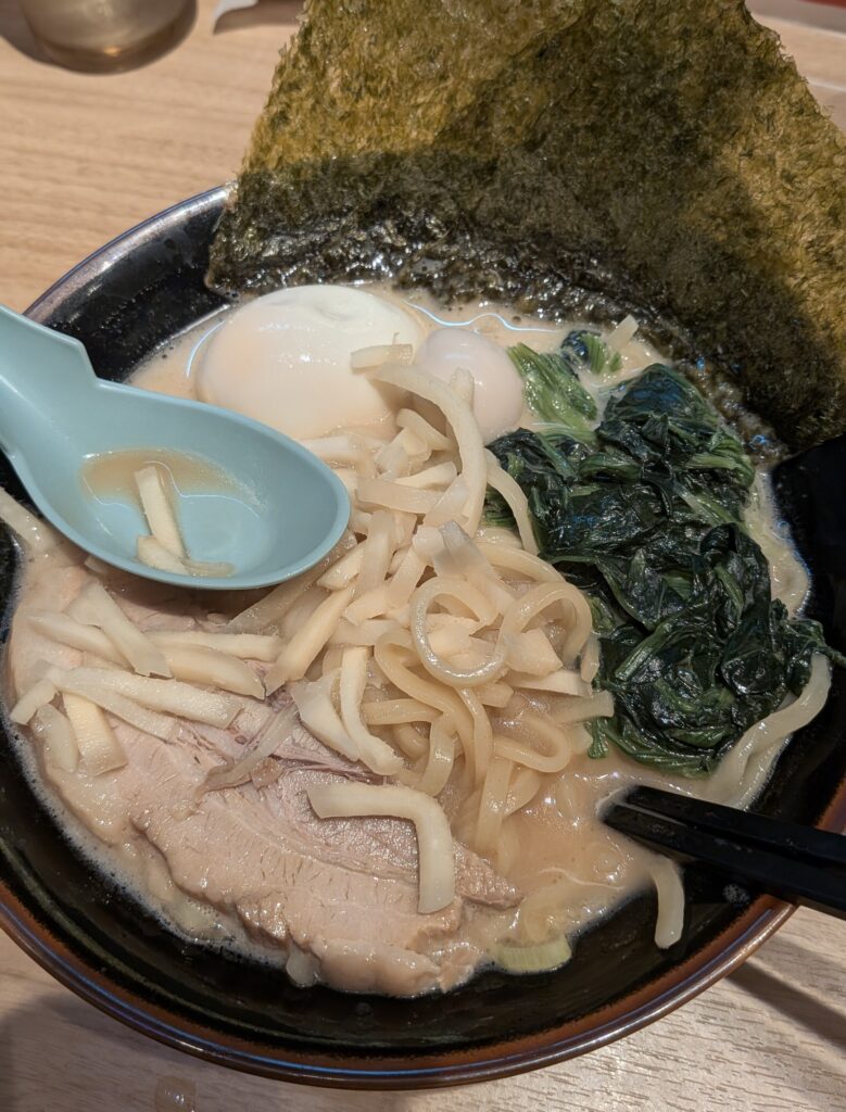 Tonkotsu shoyu ramen at Tsurumiya Honten in Yokohama, custom-topped with extra ginger for a female-friendly twist.